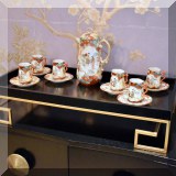 D32. Black and gold tray. 